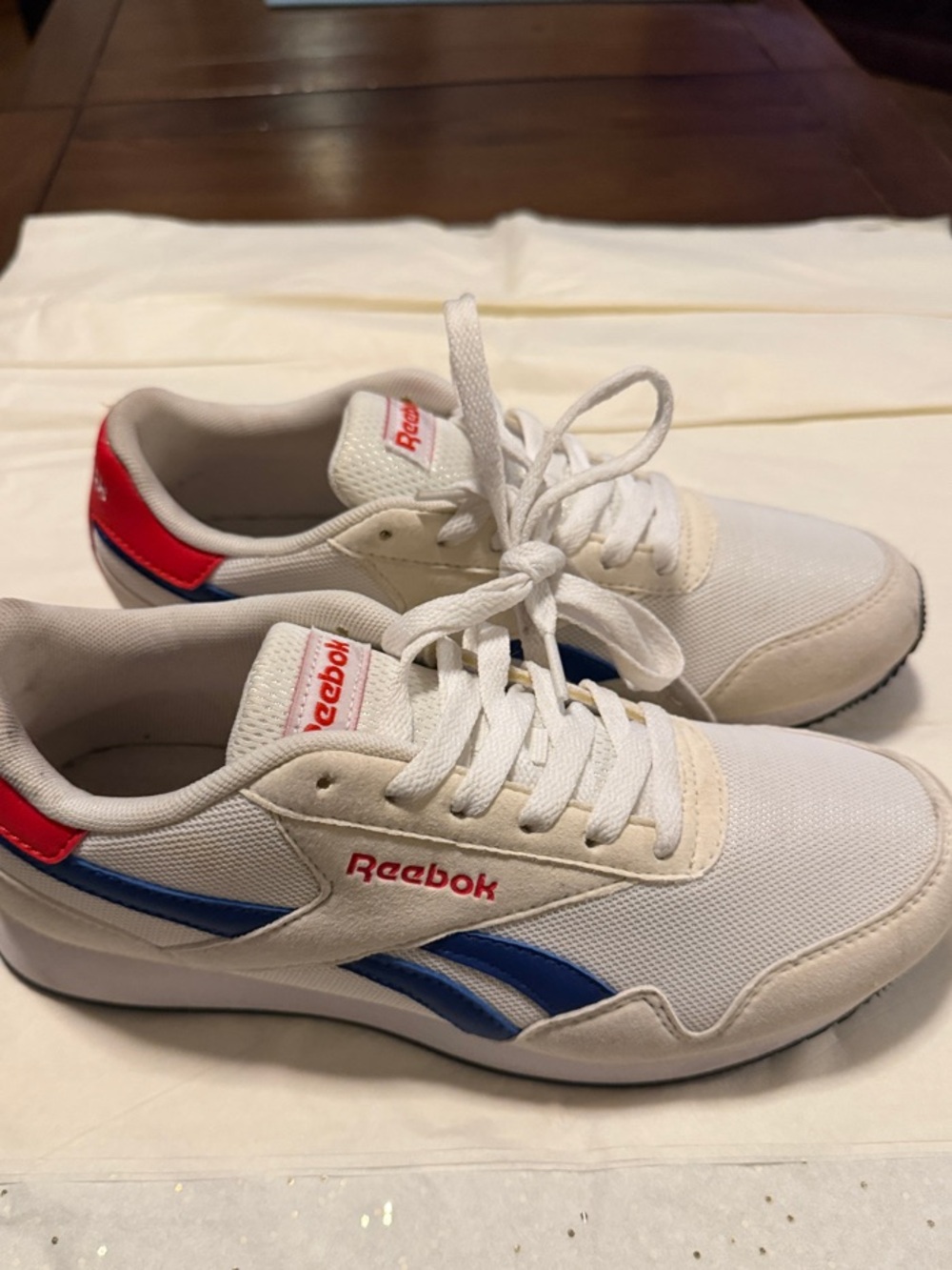 Reebok White Athletic Shoes with Blue Stripes and Red Accents